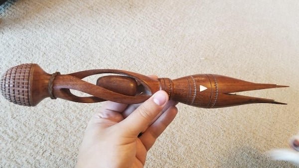 A relative who traveled a lot passed away. She had this at her house. We dont know any other details about it’s origin or purpose. The oval ball in the middle is loose and shakes around.

A: Cannibal fork