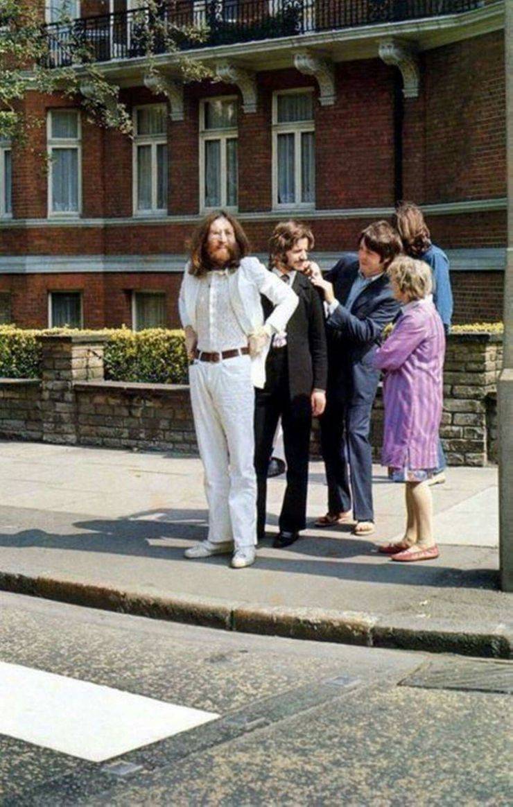 “The Beatles before crossing Abbey road in 1969.”