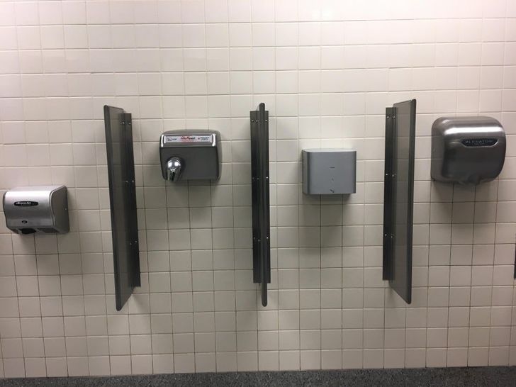funny airport pics - four different hand drying stations inside airport restroom