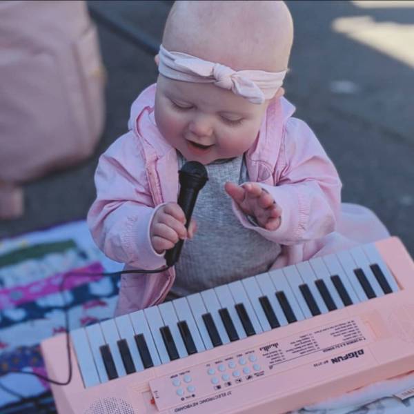 funny pics - toddler playing with synth keyboard