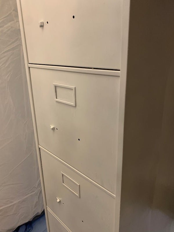 Wife decided to paint the filing cabinet. She took all the handles off then closed the doors…