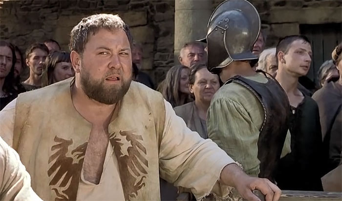 In A Knight's Tale, the scene where Mark Addy says "Yayyyy" because the audience gives no reaction to Chaucer was improvised by Addy because the extras didn't speak English (they were Eastern Europeans) and had no idea when to cheer.