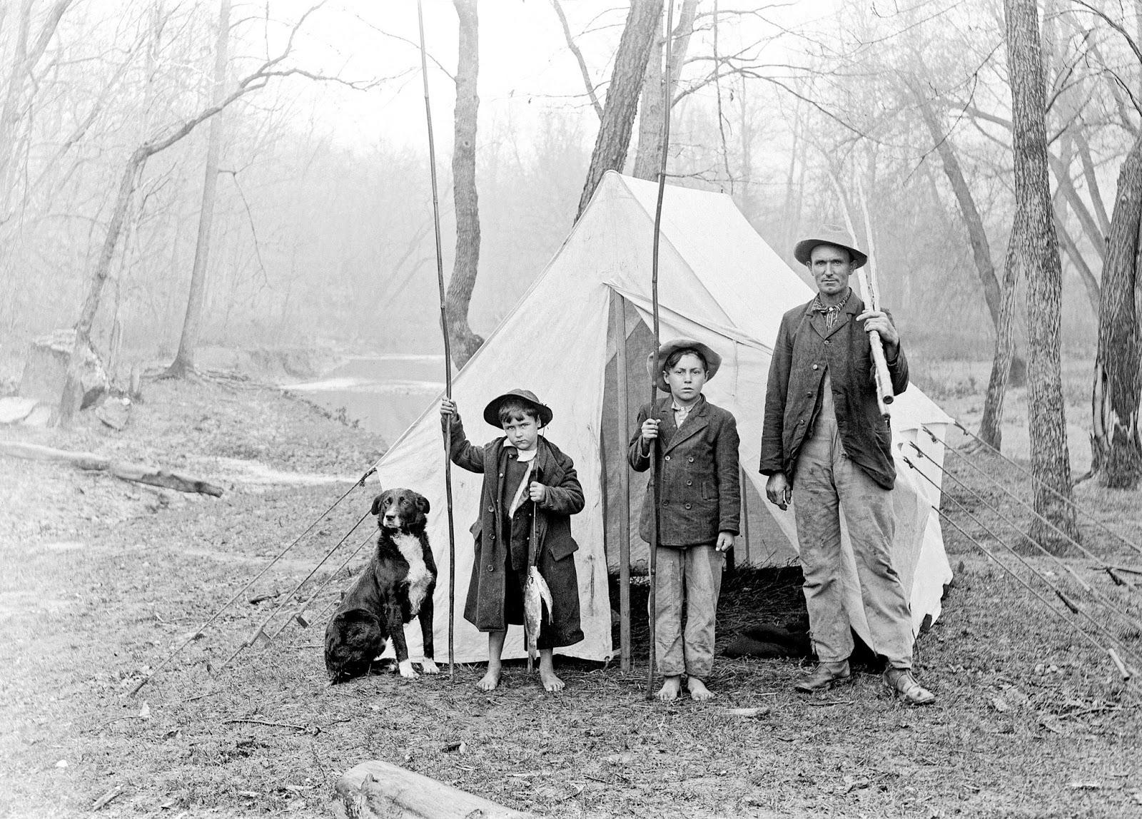 Two boys, a man, and a dog on a fishing trip, 1900-20. Photographer Charles Elliott Gill.