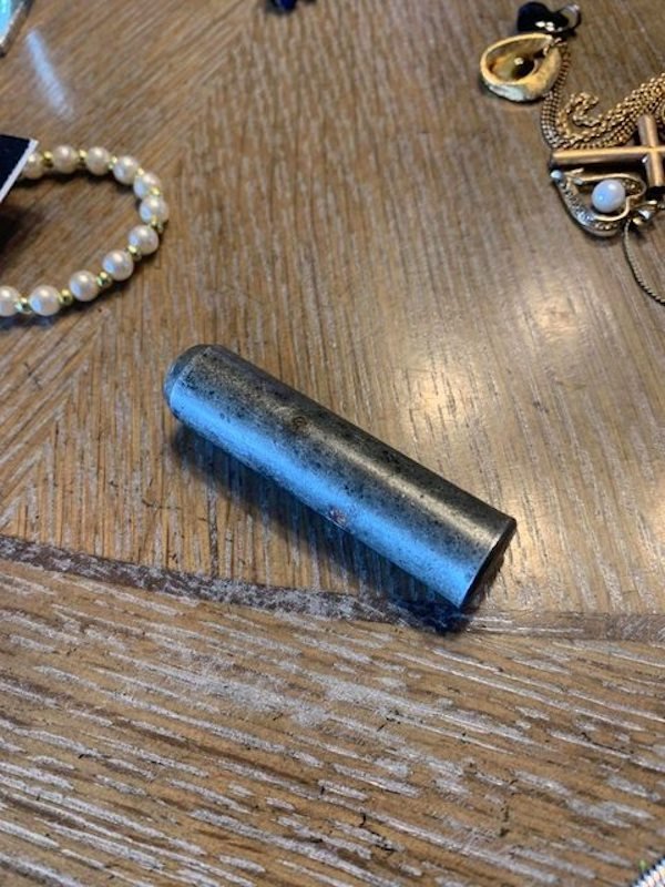 Small, heavy metal cylinder found in jewelry drawer

A: I suspect it’s a press stud tool for poppers and metal buttons. It’d either be used in a press or hit with a mallet.