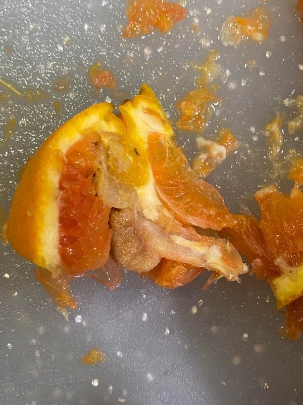 What is this weird, hard thing inside my cara cara orange?

A: The navel in navel oranges is actually another baby orange that’s been overrun by its larger brother. Sometimes the runt orange grows strangely as the two oranges grow together.