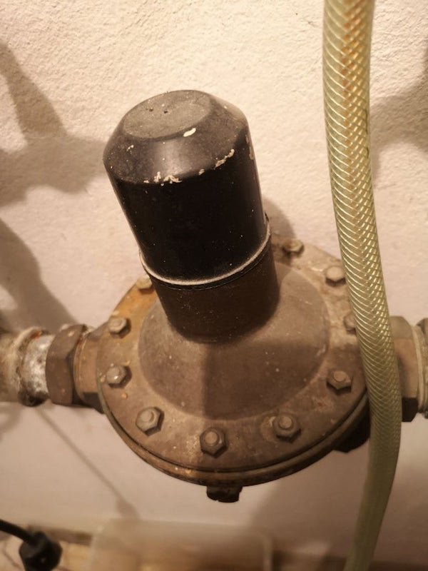 What’s the purpose of this component, mounted on the main water line of a house, after the water meter?

A: It’s a pressure regulator. It’s a valve that reduces the water pressure, so you don’t get full mains pressure out of your taps.