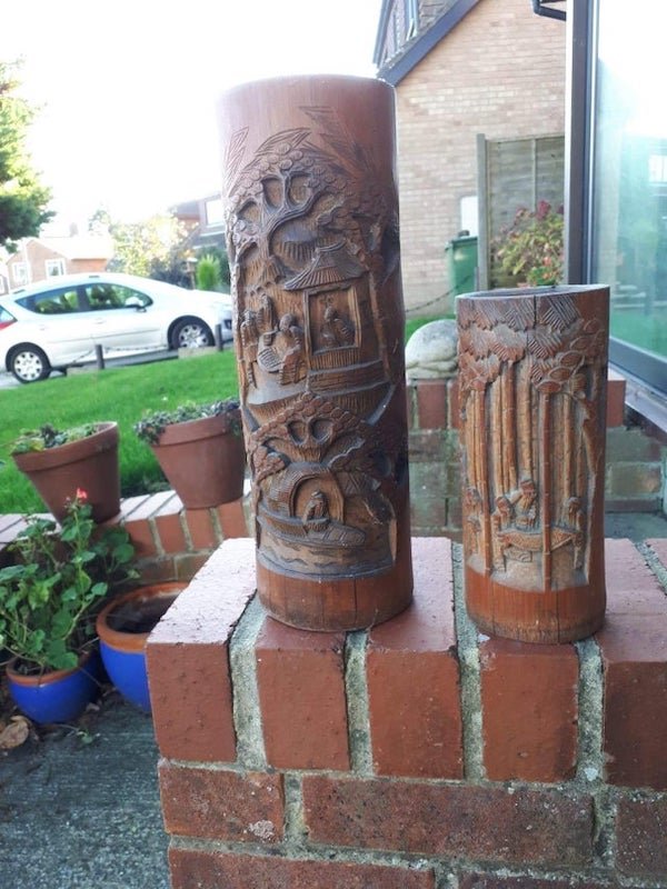 Ornate carved wooden tube containers? Not sturdy enough for umbrellas.

A: A brush pot… is a container for holding the brushes used by scribes for Chinese calligraphy.