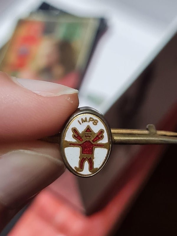 Found this is a jewelry box. Badge is from before the 60’s.

A: It’s a Scouts imp tie clip to do with the Brownies/Guides in the UK