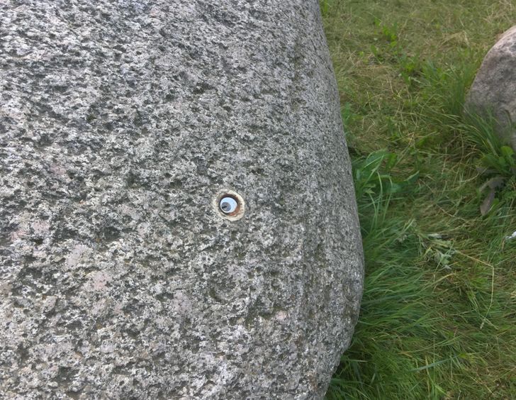 “Mysterious keyhole on a rock outside my school”