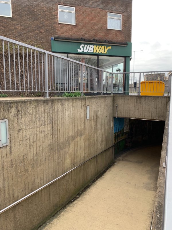 This Subway has a subway underneath it.