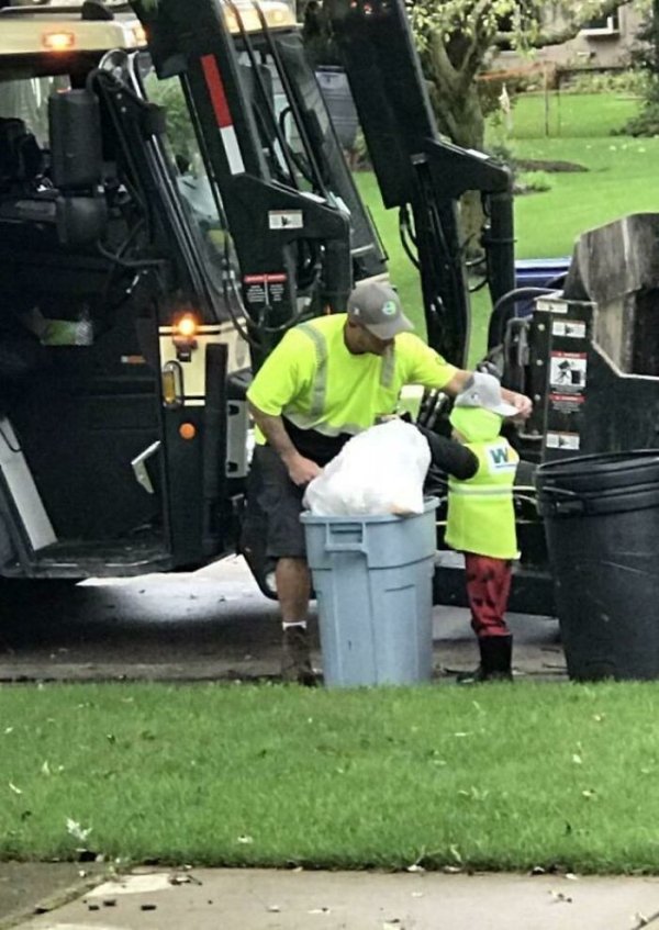 Every Thursday morning my little nephew waits for the garbage man to arrive so he can help. Today they brought him a WM hat to wear.