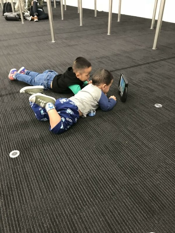 Son made a friend at an airport. They don’t speak the same language but they can co-exist nicely.