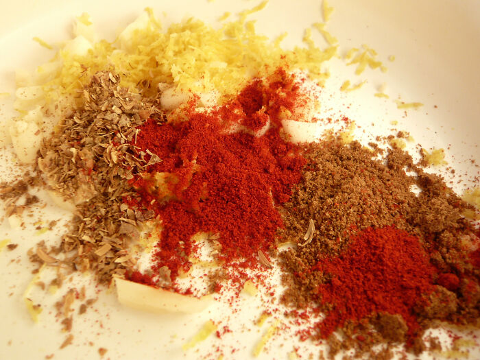 Never pour spices directly into a steaming pot on the stove. The spices will congeal in their containers from the moisture introduced. Instead put the spices in a separate side container then add to a steaming pot.