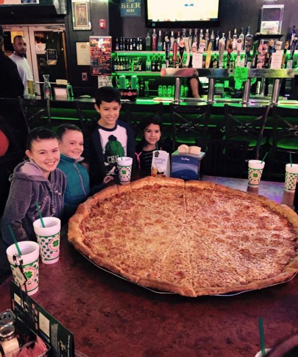 Found this old photo of me and my friends next to this giant pizza.