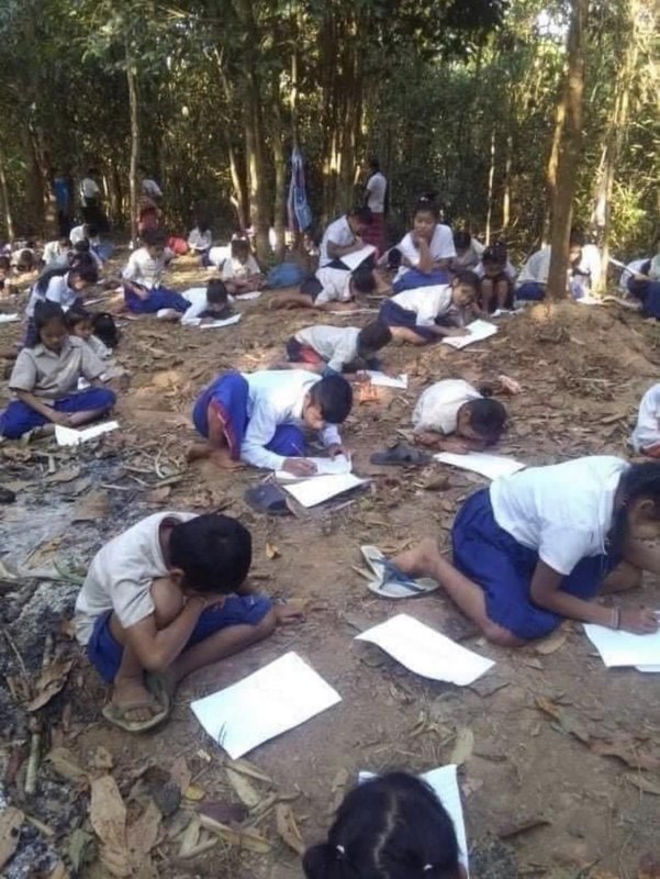 Students from Karen State, Myanmar, takes their first test for the semester in the jungle after Myanmar’s military burned down their school in March 8, 2020.
