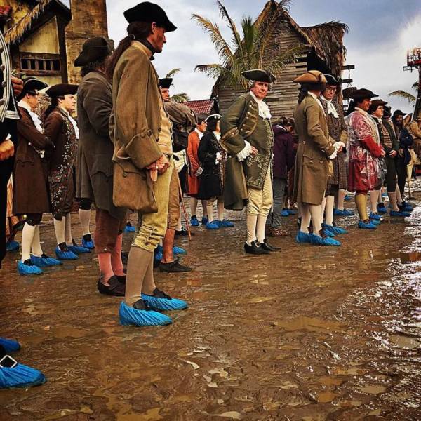 The crowd of extras in Pirates of the Caribbean worked in all types of weather. And to keep their costumes clean, the actors had to wear overshoes.