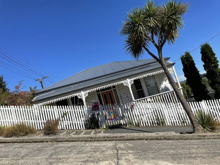 “A house on the world’s steepest street in Dunedin, NZ, when adjusted for angle.”