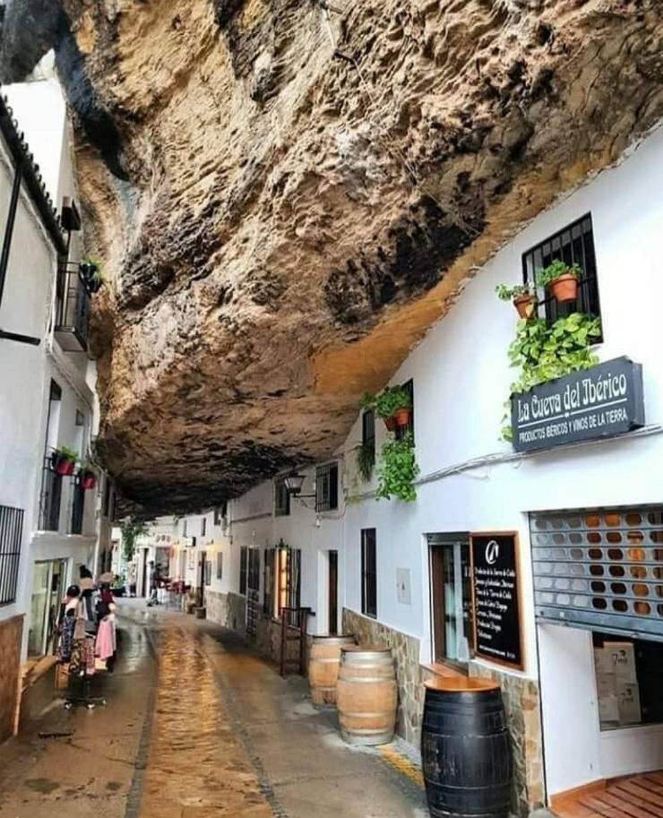 “In the town of Setenil de las Bodegas Spain, some buildings are built right into the cliffs.”