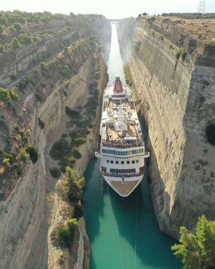 “A cruise ship passing through the Corinth Canal in Greece. Tight squeeze.”