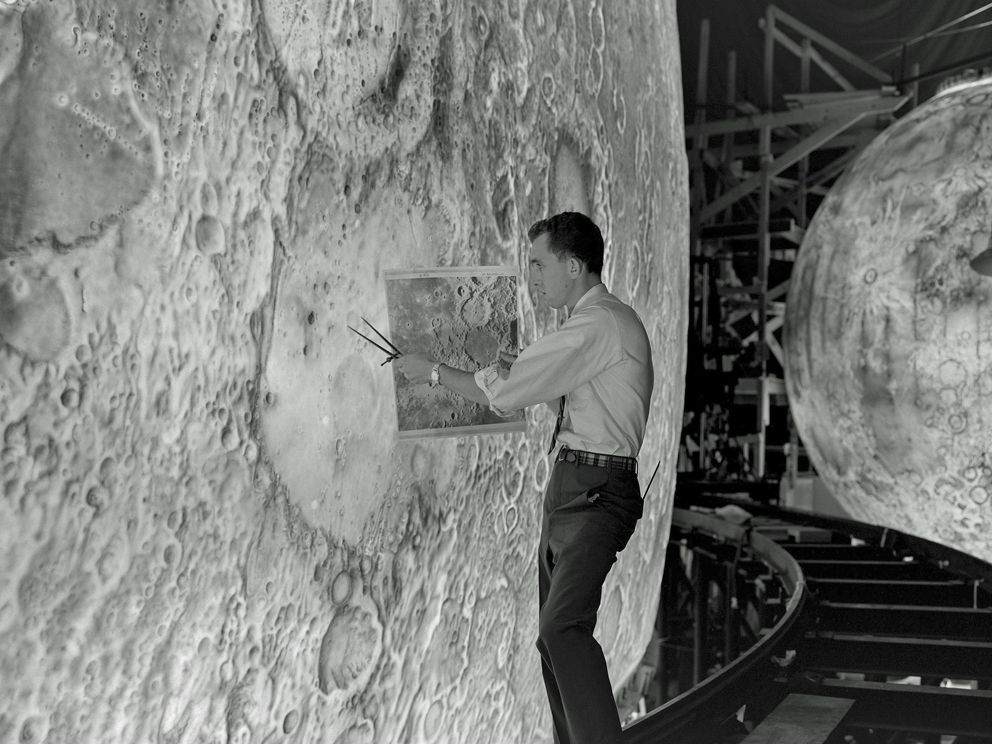 Artist uses paint brushes to recreate the lunar surface on each of four models comprising the Lunar Orbit and Landing Approach simulator (LOLA) built at Langley to study problems related to landing on the lunar surface of the moon and for astronauts to practice in a simulator, 1960’s