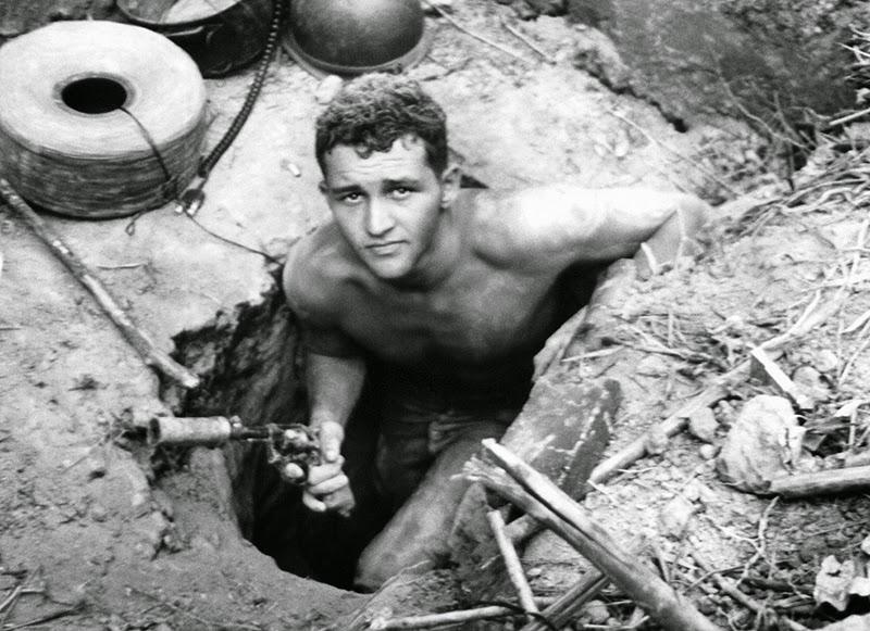 U.S. soldier: Sgt. Ronald Payne, 21, of Atlanta, Georgia, emerges from a Viet Cong tunnel while holding a silencer-equipped revolver, January 21, 1967