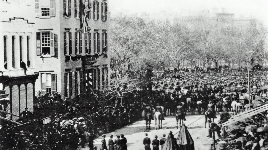The funeral procession for Abraham Lincoln after his assassination on April 15th, 1861. A young Teddy Roosevelt watches the procession from the open second story window in the left of the photo