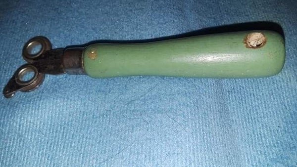 Object from the 50’s, solid wooden handle, circular metal circle things attached.

A: Vintage Apex brand Knife Sharpener/Glass Cutter In The Original Box