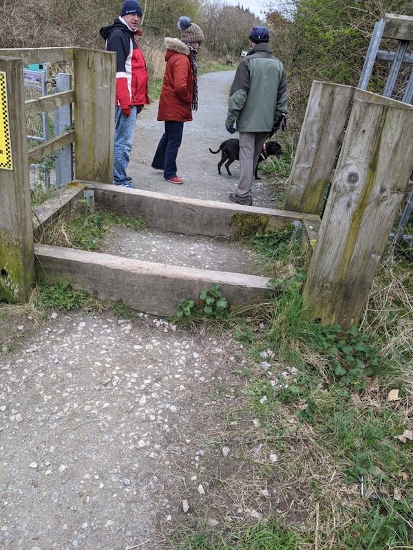 A wooden box by a gate in NW UK – on a footpath. Gate separates path from road but you can just step over

A: This is to stop motorbikes etc but allow walkers access to the path