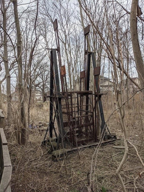 Weird (possibly rotating?) metal contraption found in a vacant lot outside Hamilton, Ontario

A: A “Swinging Gym”. You’d actually pay to get in one of these with a friend, and get it swinging with the aim of making full circles. A ton of effort and skill was required.