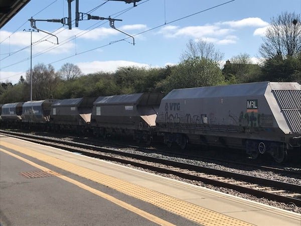 What are these carriages used to transport? In the UK, they maximise neither aerodynamics nor capacity. Look too clean for coal, doors at 45degrees to the horizontal…

A: The wagons are basically hoppers filled from the top, and empty down towards the rails, so they’re emptied on a special section of rail that has a conveyor or similar underneath it.