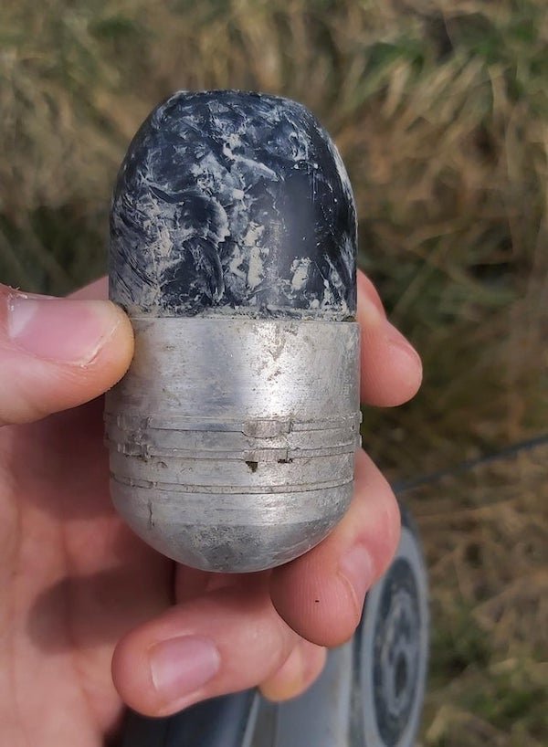 My dog found this. Bottom is made of metal and top appears to be glass or ceramic

A: It’s a Polish 40x47mm grenade from the Pallad grenade launcher.