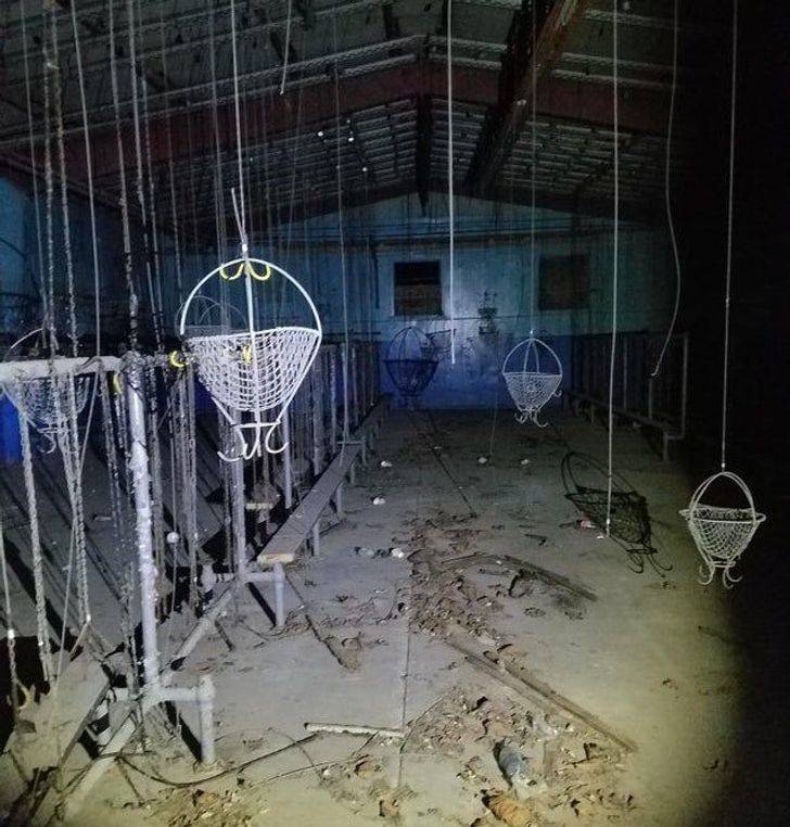 “I found this room in an abandoned building. Can anyone tell me what this building may have been for and what these things hanging from the ceiling are?”
The answer: "It’s a miners’ changing room. The hooks and baskets lift their work clothes up and out of the way of the next shift."