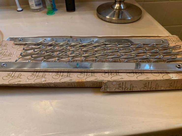 “Found it in the attic of a house I recently purchased. It is approximately 11.5” x 5″, the little flappy arms fold completely down forward or backward."
The answer: "It’s a folding tie rack."