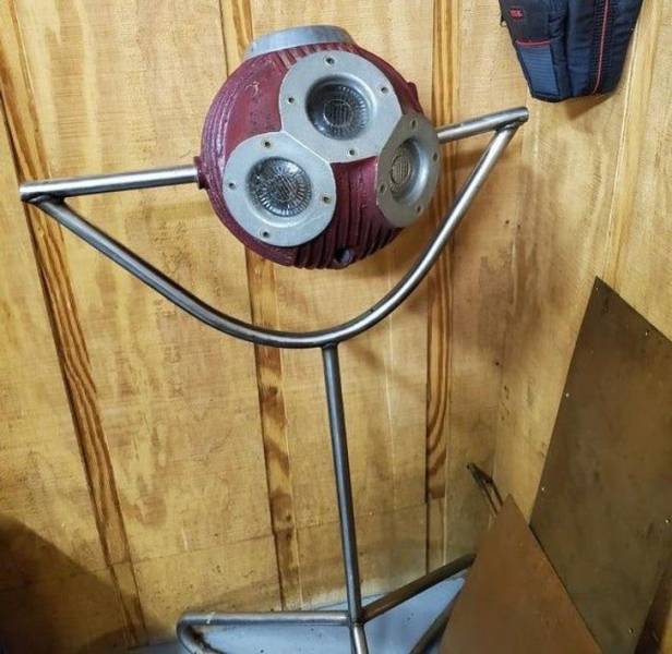 “Round, steel, rotating ball on a tripod with multiple lens/light holes, purchased at auction in 1988. The purchaser did not know what it was either.”
The answer: "It’s an operating room light with some missing pieces."