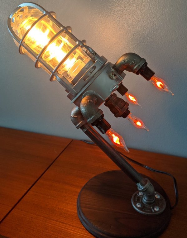 awesome designs - rocket ship lamp with lightbulb flames