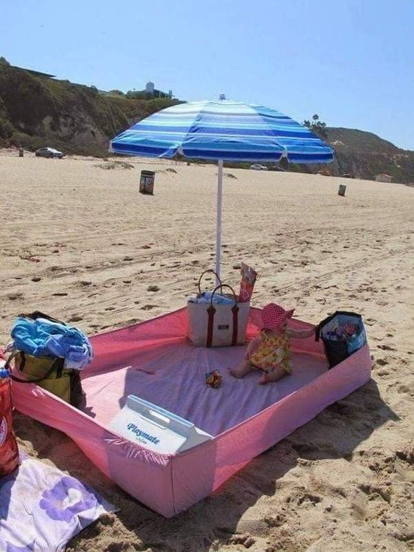 A fitted sheet at the beach can come in handy as a picnic area