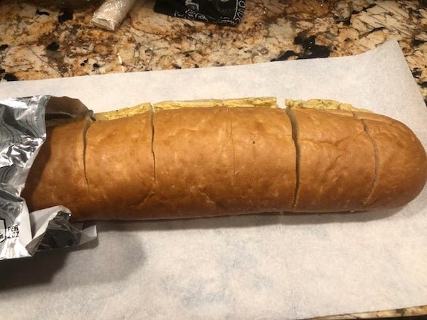 When making garlic bread (store bought or homemade), slice the bread before baking it. That way once it’s done, you just pull a slice off instead of having to cut hot bread and getting crumbs everywhere.