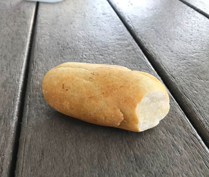 This rock looks like a loaf of bread with a bite taken out.