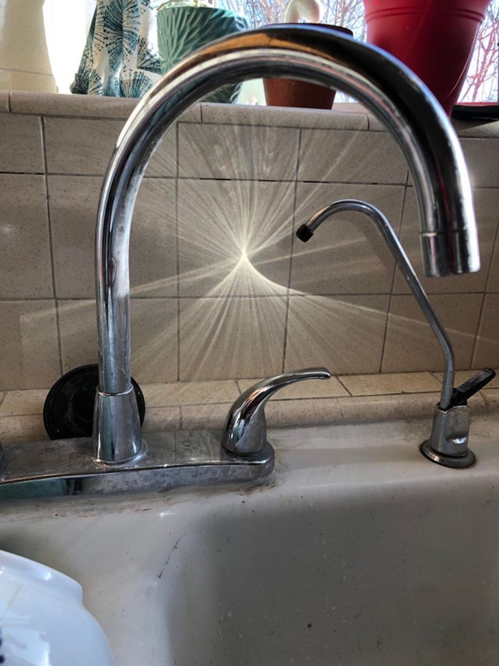“This reflection of the sun off my curved metal faucet”