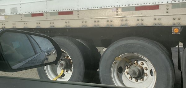 What are these straps for on this semi’s wheels?

A: Those are indicators for the driver to be able to tell if his wheels are spinning. Driving an 18 wheeled beast it can sometimes be difficult to “feel” if a wheel has seized, so this is a quick visual indicator.