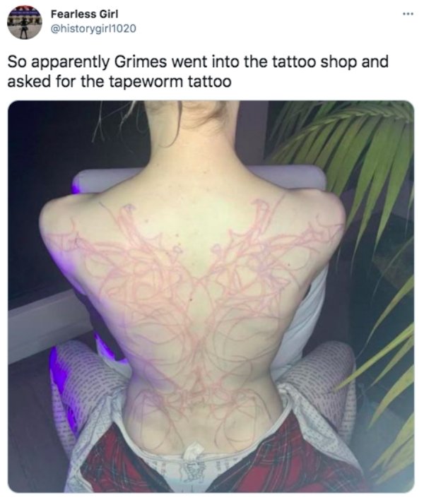 shoulder - Fearless Girl So apparently Grimes went into the tattoo shop and asked for the tapeworm tattoo
