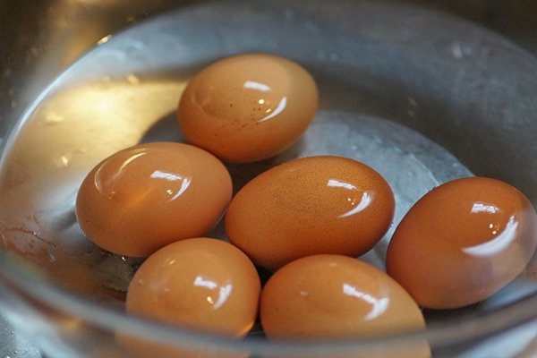 Adding vinegar to your cooking water makes your hard-boiled eggs easier to peel.

Vinegar doesn’t do much, but there are a few things that can help you peel hard-boiled eggs. The older an egg is, the easier it is to peel. For another easy trick, submerge eggs in cold water immediately after cooking.