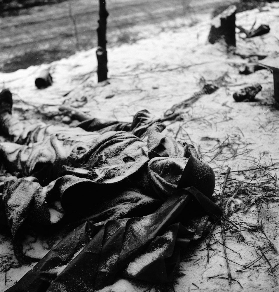 The frozen corpse of a German soldier killed during the Battle of the Bulge, 1944