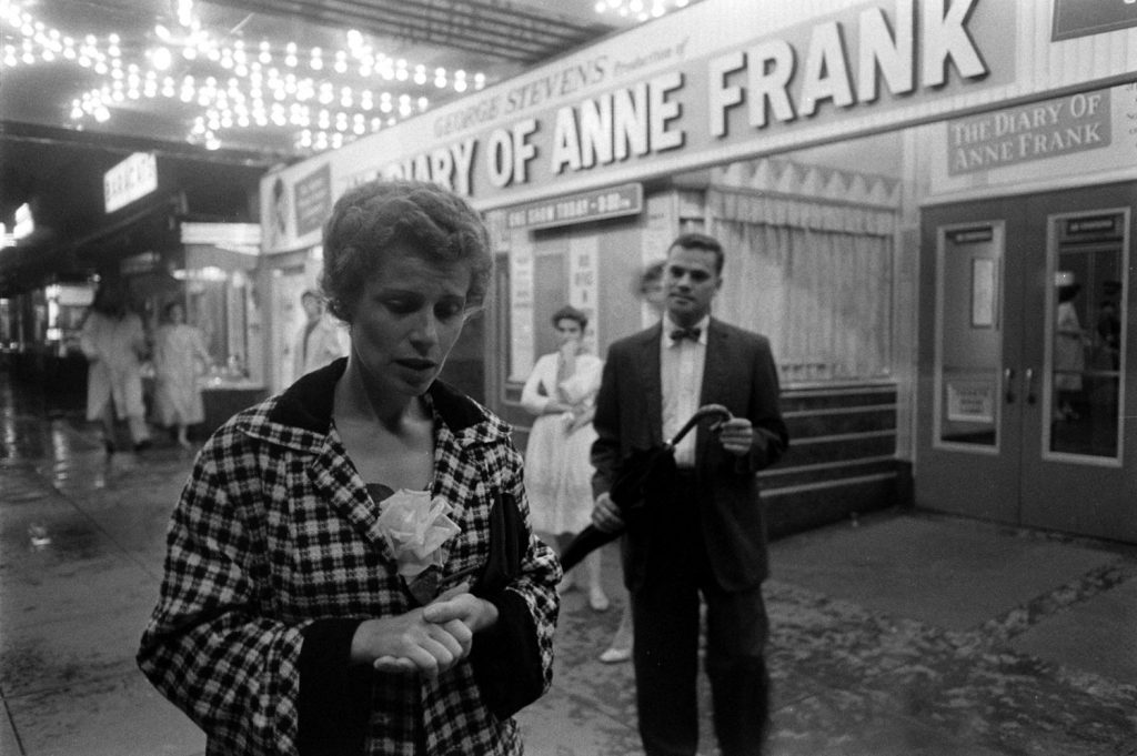 Barbara Ledermann, a childhood friend of Anne Frank, outside a cinema showing the film “The Diary of Anne Frank.” She stood debating whether to go in. Finally she decided not to. “I’ve seen too much human suffering already,” she said. 1959