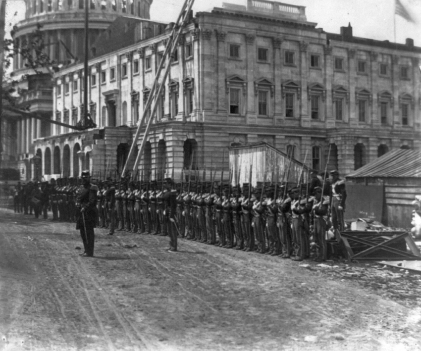 A few weeks after the outbreak of the Civil War, United States union soldiers begin guarding Washington D.C. from rebel attacks as construction of the Capitol Building continues on around them, May 1861