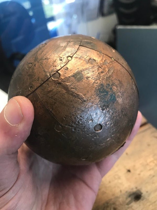 Found in an old garage. Thin layers of copper not very weighty

A: It’s a decorative ball