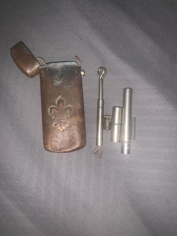 Found in deceased WW2 Veterans Toolbox, no clue what it is but the guy loved woodworking.

A: It’s a fire starting kit