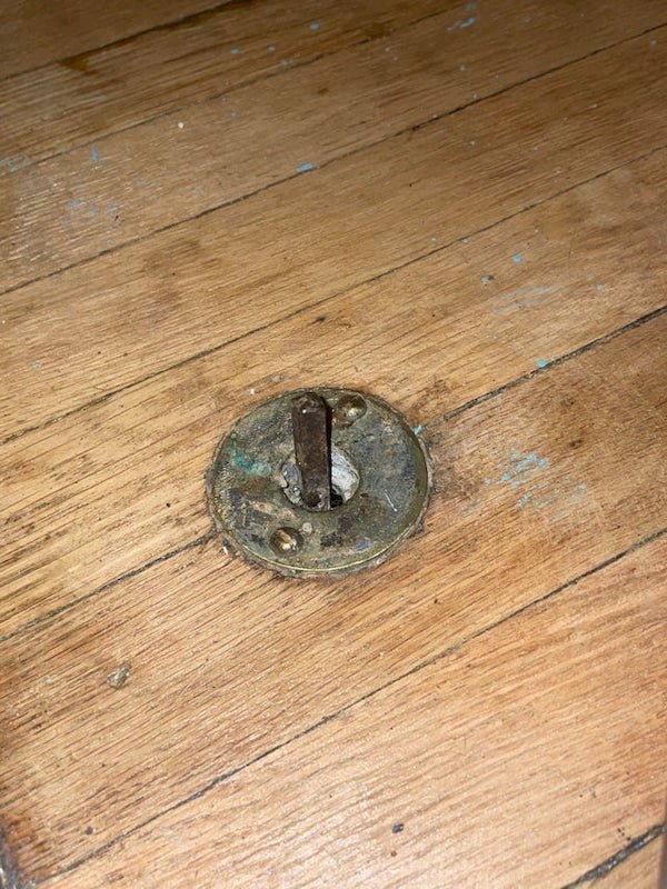 Steel rod sticking up from living room floor, it’s about two inches tall and can be moved left or right.

A: It’s the gas fireplace globe valve.