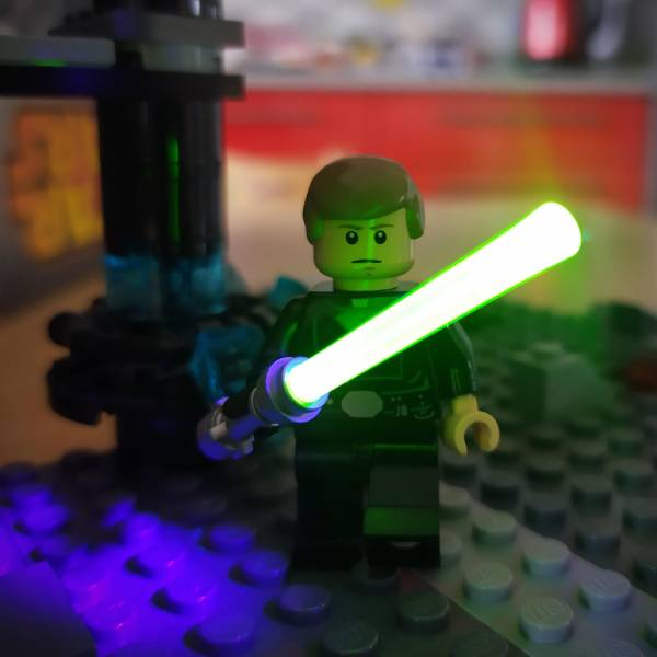 “Some LEGO lightsaber blades look great on photos, when lit by UV light. No postprocessing here.”