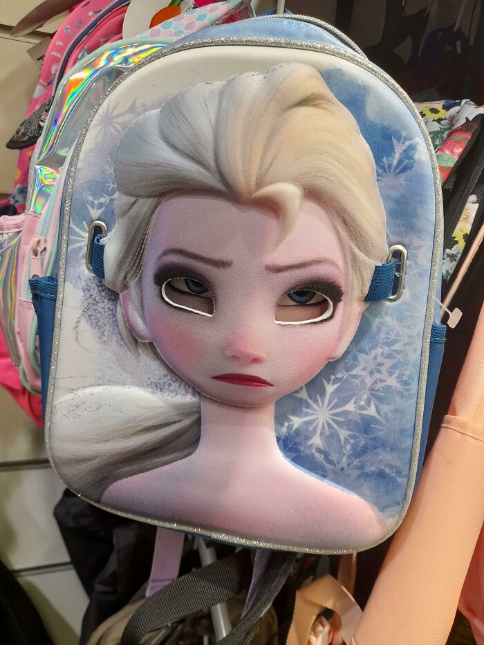 This Elsa Backpack Has A Mask On It So You Can Wear It... But If It's On The Backpack, Elsa Looks Dead On The Inside